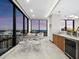Bright living room with large windows, city views, modern furnishings, and elegant marble floors at 50 Central Ave # 17Phd, Sarasota, FL 34236