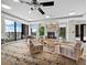 Resident lounge area with cozy seating around a fireplace, and beautiful ocean views at 50 Central Ave # 17Phd, Sarasota, FL 34236