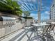 Outdoor kitchen featuring a high-end grill, table and chairs, and an awning for shade at 50 Central Ave # 17Phd, Sarasota, FL 34236