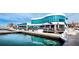 Waterfront restaurant with outdoor seating and glass windows providing views of the marina and water at 50 Central Ave # 17Phd, Sarasota, FL 34236
