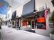 Attractive storefront in a shopping district with awnings, gallery windows, and an American flag at 50 Central Ave # 17Phd, Sarasota, FL 34236
