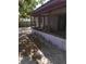 View of a backyard featuring a screened porch and a view of a grassy backyard at 519 36Th E Ave, Bradenton, FL 34208