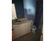 Bathroom with a white vanity, sink, toilet, and blue painted walls at 519 36Th E Ave, Bradenton, FL 34208