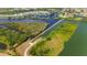 Aerial view showcasing a waterfront community with access to canals, waterways, and scenic landscapes at 5633 Key Largo Ct # B-08, Bradenton, FL 34203