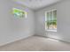 Bright bedroom features a standard window and a small horizontal window at 5633 Key Largo Ct # B-08, Bradenton, FL 34203