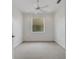 This bedroom features neutral walls, carpet flooring, and a ceiling fan with lights at 5633 Key Largo Ct # B-08, Bradenton, FL 34203