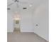 Bright bedroom with neutral walls, overhead lighting and entrance to ensuite bathroom with double vanity at 5633 Key Largo Ct # B-08, Bradenton, FL 34203