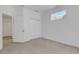 This bedroom features clean walls, neutral carpet, and an accent window at 5633 Key Largo Ct # B-08, Bradenton, FL 34203
