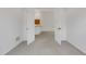 Bedroom featuring carpet flooring, neutral walls, and an open double door entrance at 5633 Key Largo Ct # B-08, Bradenton, FL 34203