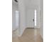 Bright foyer with neutral tile, white trim, and a view into the living space at 5633 Key Largo Ct # B-08, Bradenton, FL 34203