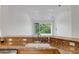Granite countertop in kitchen overlooks a bright and airy living area with sliding glass doors at 5633 Key Largo Ct # B-08, Bradenton, FL 34203