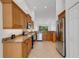 Spacious kitchen with stainless steel appliances, granite countertops, and ample cabinetry at 5633 Key Largo Ct # B-08, Bradenton, FL 34203