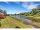 Lush landscaping and water fountain enhancing the community pond, creating a serene atmosphere at 5633 Key Largo Ct # B-08, Bradenton, FL 34203