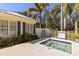 Inviting spa with an accessible rail, surrounded by lush foliage and community signage at 5633 Key Largo Ct # B-08, Bradenton, FL 34203