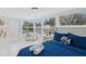 Serene bedroom with ample natural light, a comfortable bed, and stylish decor at 578-580 Companion Way, Longboat Key, FL 34228