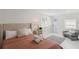 Inviting bedroom featuring a queen-size bed, cozy decor, and natural light at 578-580 Companion Way, Longboat Key, FL 34228