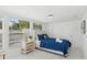 Bright bedroom featuring a comfortable queen-size bed, closet, and large window at 578-580 Companion Way, Longboat Key, FL 34228