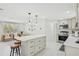 Bright kitchen boasts stainless steel appliances, a central island, and modern finishes at 578-580 Companion Way, Longboat Key, FL 34228