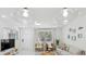 Bright living room featuring coastal decor, modern lighting, and a cozy seating arrangement at 578-580 Companion Way, Longboat Key, FL 34228