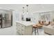 Open floor plan with views from the kitchen, stainless appliances, and island seating at 578-580 Companion Way, Longboat Key, FL 34228