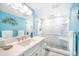 Bathroom featuring a spacious glass shower, bright light and plenty of vanity space at 6470 Mourning Dove Dr # 201, Bradenton, FL 34210