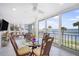 Open dining area with seating for four and beautiful ocean views through large windows at 6470 Mourning Dove Dr # 201, Bradenton, FL 34210