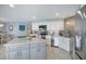 Well-equipped kitchen with stainless steel appliances and an island overlooking the dining area at 6470 Mourning Dove Dr # 201, Bradenton, FL 34210
