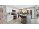 Modern kitchen with stainless steel appliances, granite countertops and island seating at 6470 Mourning Dove Dr # 201, Bradenton, FL 34210