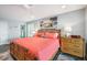 Comfortable bedroom with a large bed, stylish furnishings, and bright light at 6470 Mourning Dove Dr # 201, Bradenton, FL 34210