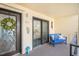 Inviting patio with blue bench, decor, and unit number, offering a welcoming outdoor space at 6470 Mourning Dove Dr # 201, Bradenton, FL 34210