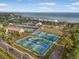 Aerial view of a large tennis and pickleball complex near the water at 6470 Mourning Dove Dr # 201, Bradenton, FL 34210