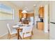 Kitchen and breakfast nook area featuring wood cabinets and stainless-steel appliances at 6519 43Rd E Ct, Sarasota, FL 34243