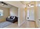 Bright entryway featuring tile floors, high ceilings, and a glimpse into the adjacent living space at 6519 43Rd E Ct, Sarasota, FL 34243