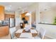 View of open concept kitchen and breakfast nook with wood cabinets and stainless-steel appliances at 6519 43Rd E Ct, Sarasota, FL 34243