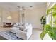 Open concept living room with dining area featuring tiled floors, and bright natural light at 6519 43Rd E Ct, Sarasota, FL 34243
