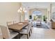 Open-concept living space with tile floors, vaulted ceilings, and a view of the outdoors at 6519 43Rd E Ct, Sarasota, FL 34243