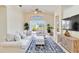 Bright living room featuring tile floors, vaulted ceilings, and a view of the backyard at 6519 43Rd E Ct, Sarasota, FL 34243