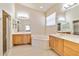 Spacious main bathroom with double vanities, a soaking tub, and a separate shower at 6519 43Rd E Ct, Sarasota, FL 34243