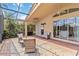 Spacious lanai with multiple seating areas, fans, and access to interior rooms at 6519 43Rd E Ct, Sarasota, FL 34243