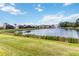 Picture perfect view of the pond with fountain and manicured lawns at 6519 43Rd E Ct, Sarasota, FL 34243