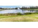 Scenic view of pond and fountain with green lawn in the foreground at 6519 43Rd E Ct, Sarasota, FL 34243
