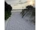 Scenic path through lush vegetation leading to a serene beach with calm ocean waters at sunset at 6610 Midnight Pass Rd # 11, Sarasota, FL 34242
