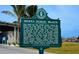 Siesta Public Beach historical sign detailing island history, surrounded by beach landscape at 6610 Midnight Pass Rd # 11, Sarasota, FL 34242
