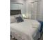A serene bedroom with a plush bed, soft lighting, and plenty of storage, designed for relaxation at 6610 Midnight Pass Rd # 11, Sarasota, FL 34242