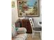Cozy dining area featuring coastal artwork, a charming table, and a decorative cabinet at 6610 Midnight Pass Rd # 11, Sarasota, FL 34242