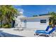 Charming exterior features beach access, outdoor seating and two lounge chairs, perfect for relaxing at 6610 Midnight Pass Rd # 11, Sarasota, FL 34242