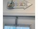 Charming 'Beach' sign, adorned with a sailboat, evoking a relaxed, coastal vibe within the home at 6610 Midnight Pass Rd # 11, Sarasota, FL 34242