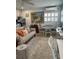 Cozy living room blends comfort with modern style, showcasing a sofa and dining area perfect for relaxation at 6610 Midnight Pass Rd # 11, Sarasota, FL 34242
