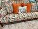Close-up featuring a colorful sofa with throw pillows, set on a stylish rug at 6610 Midnight Pass Rd # 11, Sarasota, FL 34242