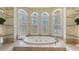 Soaking tub with three windows providing natural light at 6819 Dominion Ln, Lakewood Ranch, FL 34202